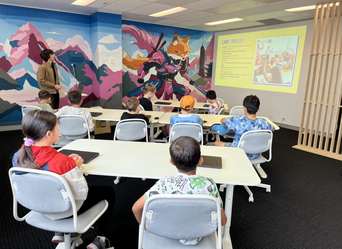 A Skill Samurai class watching the screen, fox mural along the wall